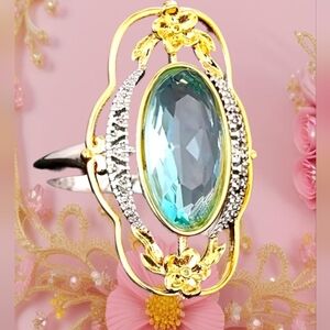 Elegant Gold and Silver Ring with Blue Gemstone